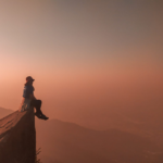 Girl sitting on a mountain area