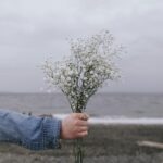 Girl giving a bunch of flowers