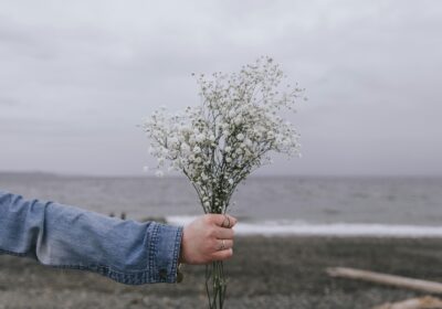 Girl giving a bunch of flowers
