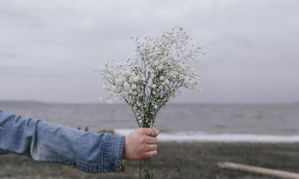 Girl giving a bunch of flowers