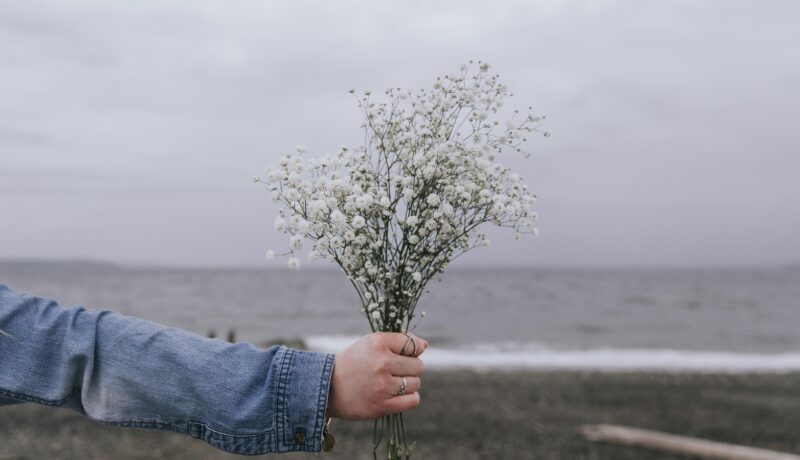 Girl giving a bunch of flowers