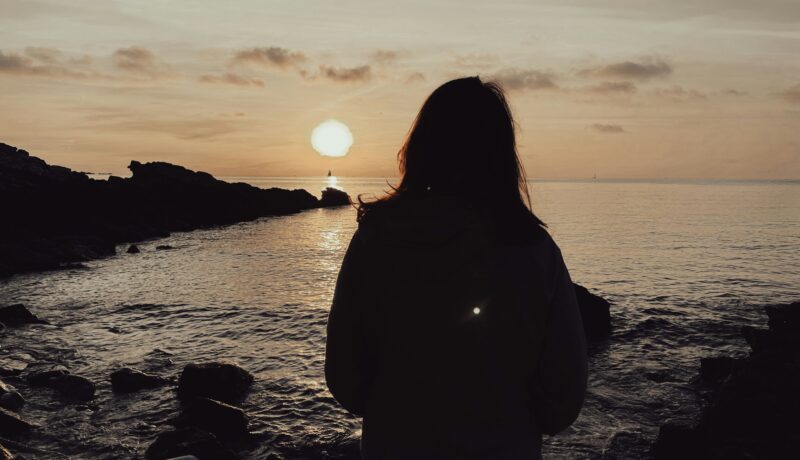Girl looking on a beach area