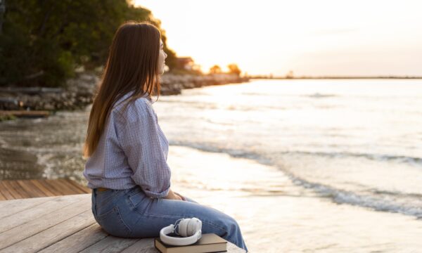 Girl sitting on a beach area